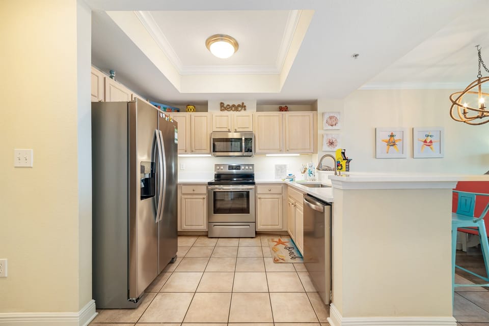 Clean lines and modern finishes define this well-appointed kitchen, offering a sleek and stylish cooking environment.