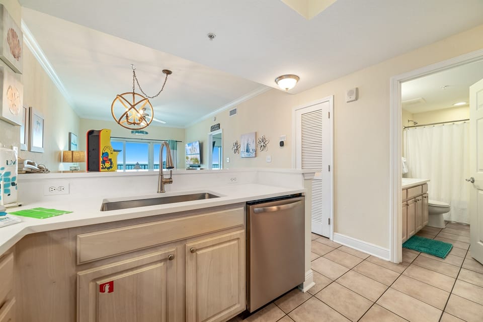 A tidy and functional kitchen countertop. This organized space, complete with coffee makers, a toaster, and a paper towel holder, makes everyday tasks a breeze.