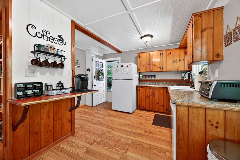 The well-equipped kitchen and coffee bar make mornings easy and inviting.