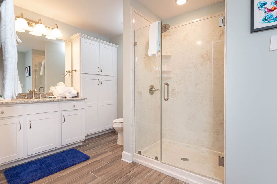 Refresh yourself in the spacious walk-in shower in the guest bath, enjoying the soothing vibe after a day on the coast