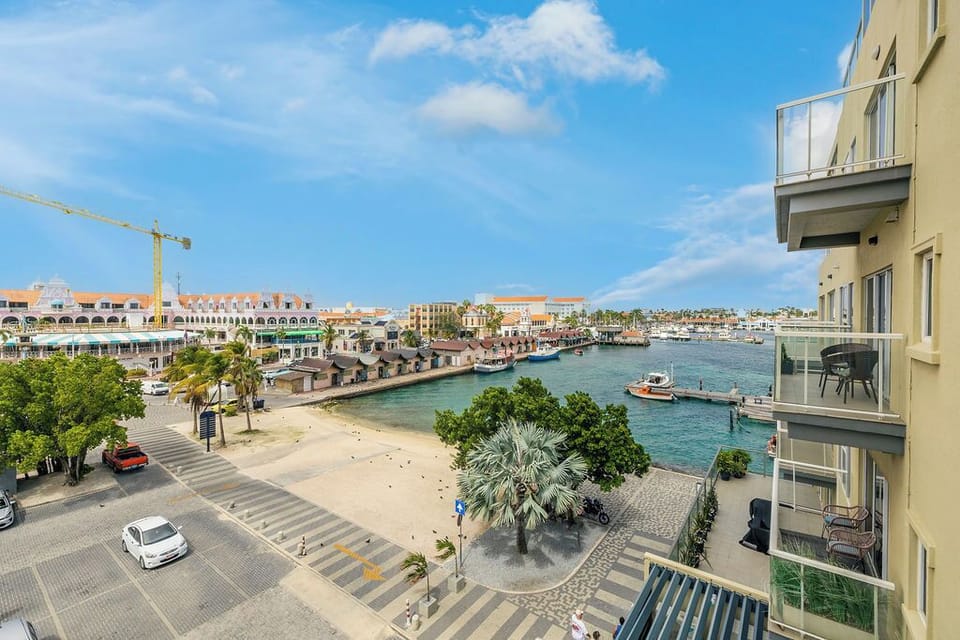 This balcony offers sweeping views of the marina, waterfront promenade, and vibrant coastal architecture—an ideal spot to enjoy the surrounding coastal charm and activity.