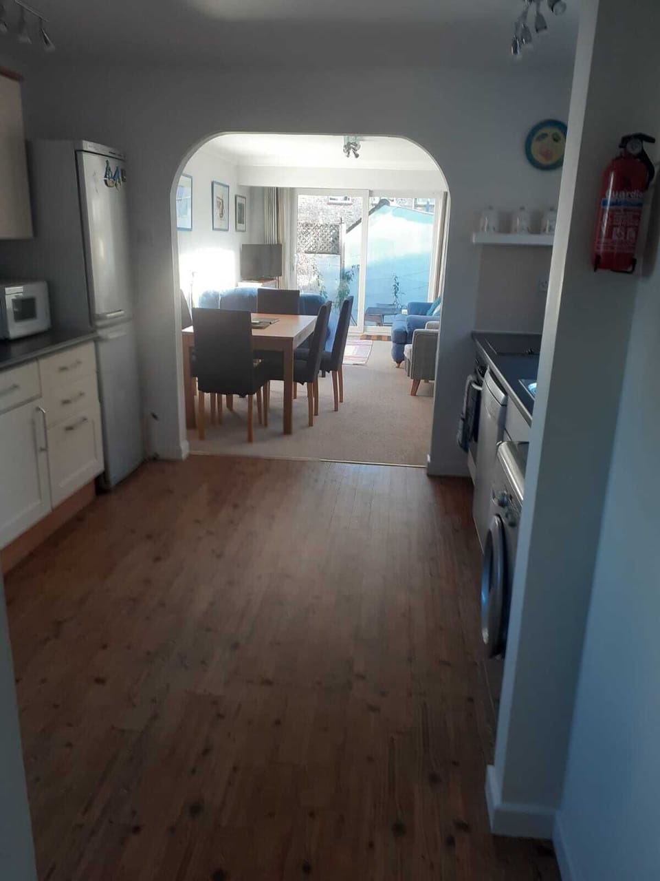 Kitchen leading to dining area and sitting room. 