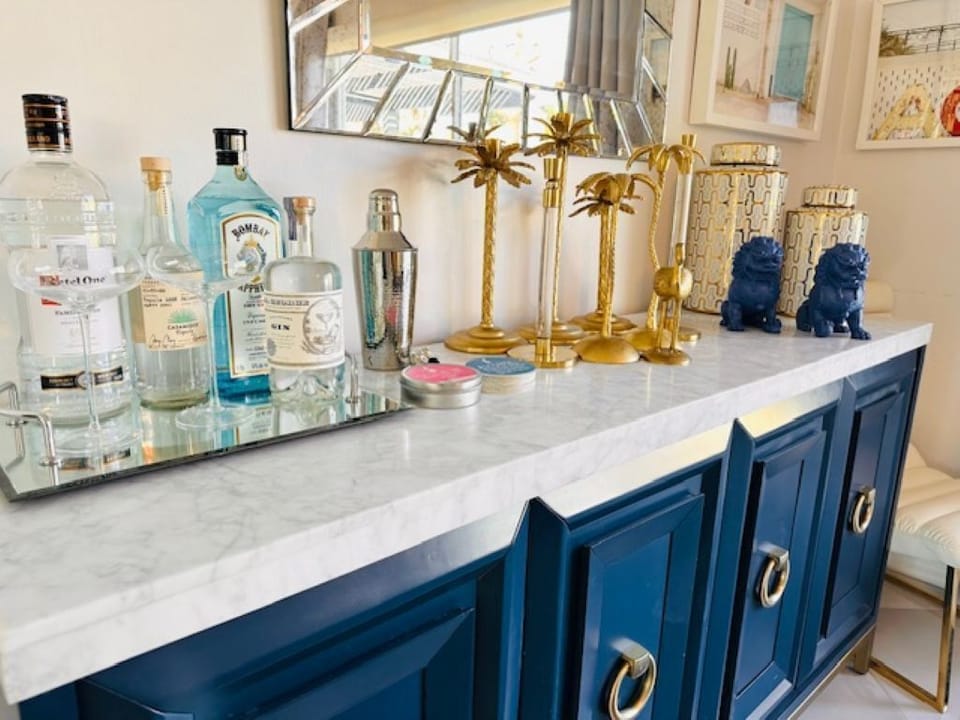 Bar Cabinet in Dining Room with Outdoor Dining Supplies and Games Inside