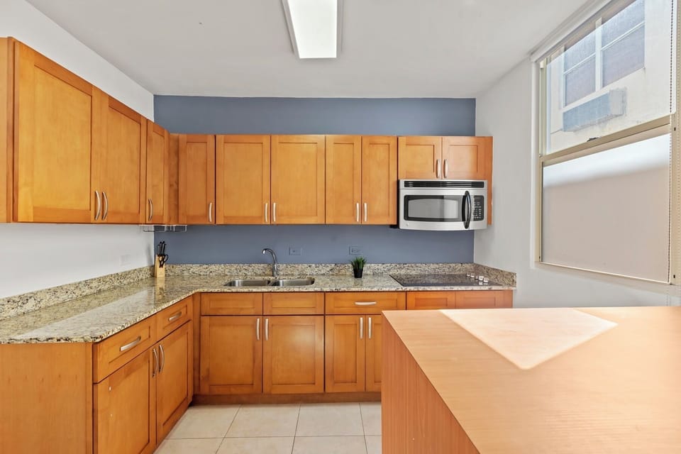 A charming and functional kitchen. The warm wooden cabinets and spacious counters provide everything you need to prepare meals with ease.