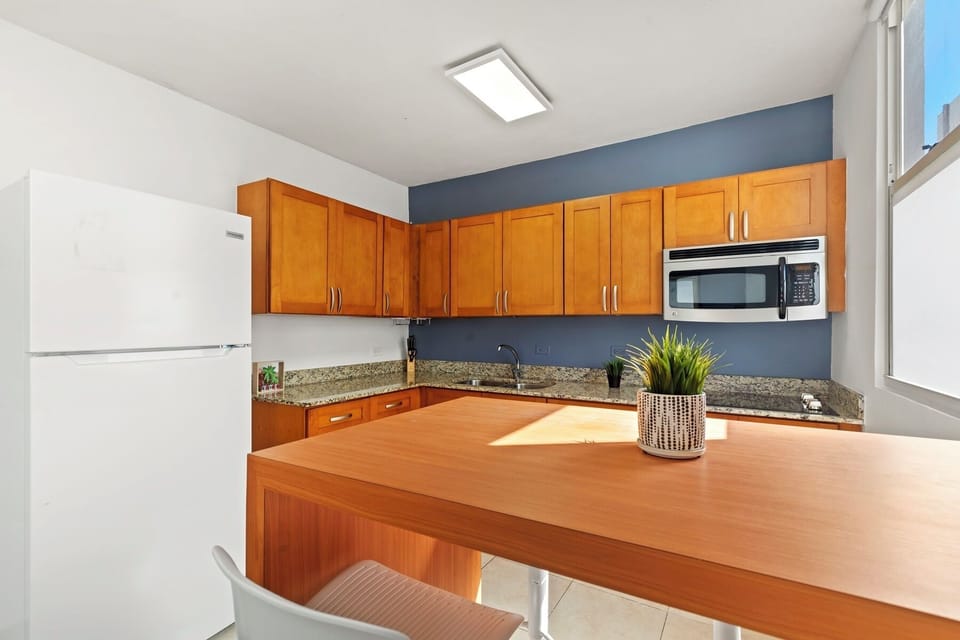 Your home away from home kitchen. This bright and practical space is fully stocked with all the essentials for a convenient and enjoyable cooking experience.