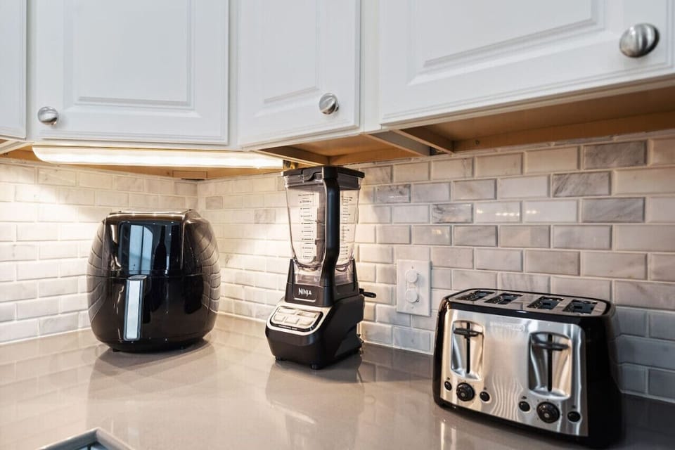 Tons of counter space and updated appliances lend a hand to the ultimate functionality of this perfect beachy kitchen.