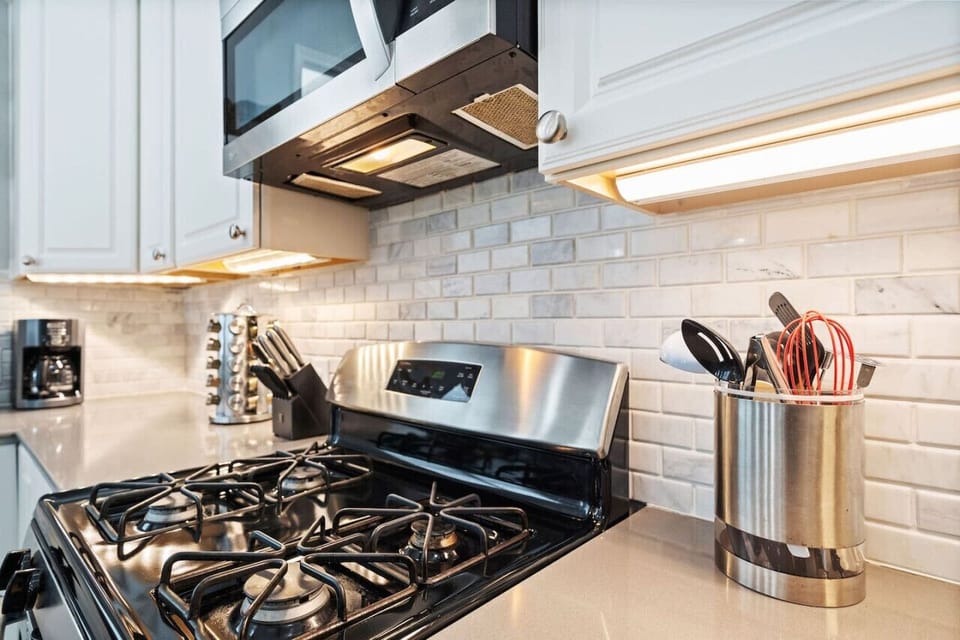 Tons of counter space and updated appliances lend a hand to the ultimate functionality of this perfect beachy kitchen.
