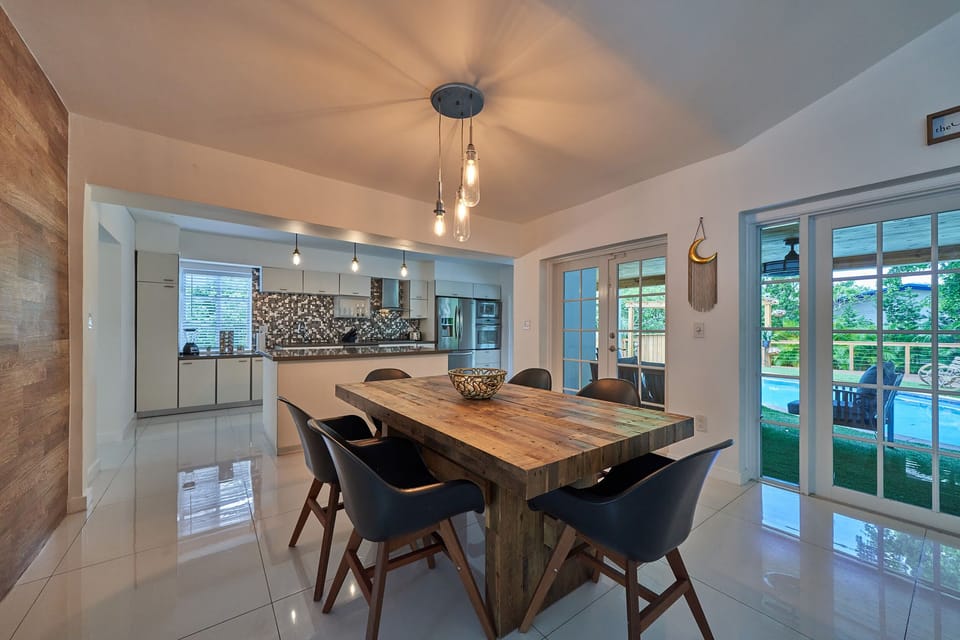 Dining table located next to the backyard.