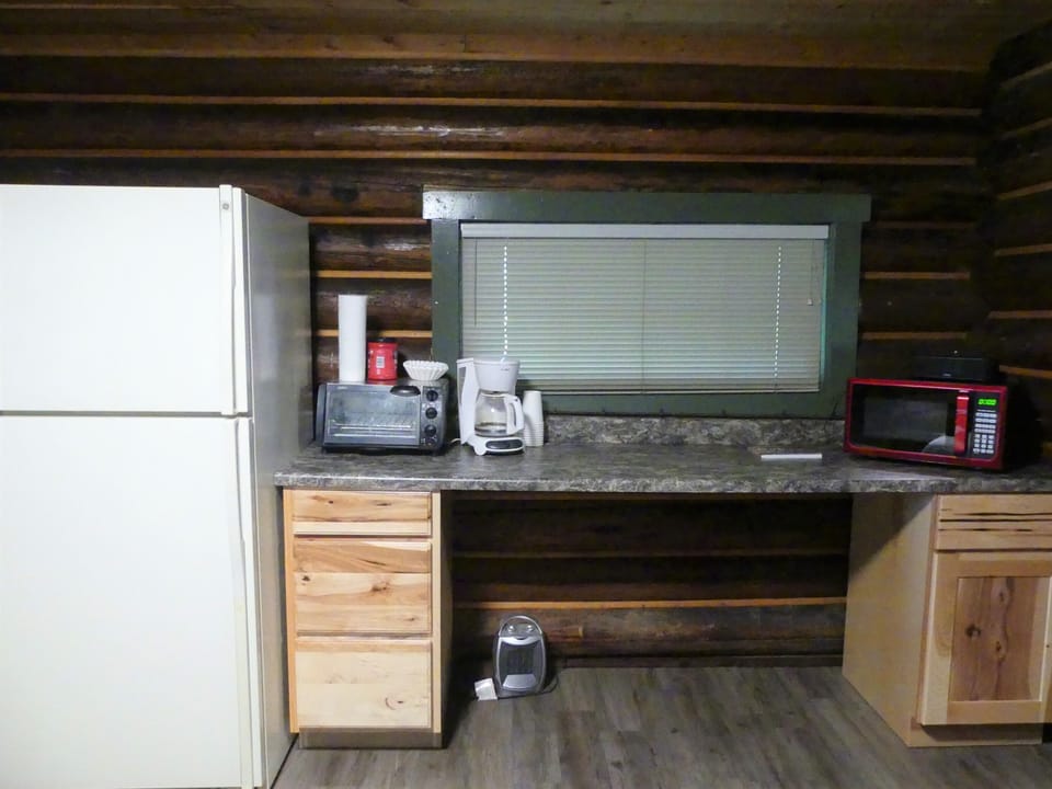 Kitchen (no plumbing) fridge, toaster, microwave, coffee pot