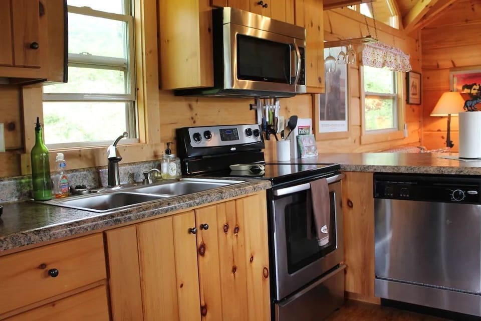 Kitchen with stove, microwave, dishwasher, and refrigerator