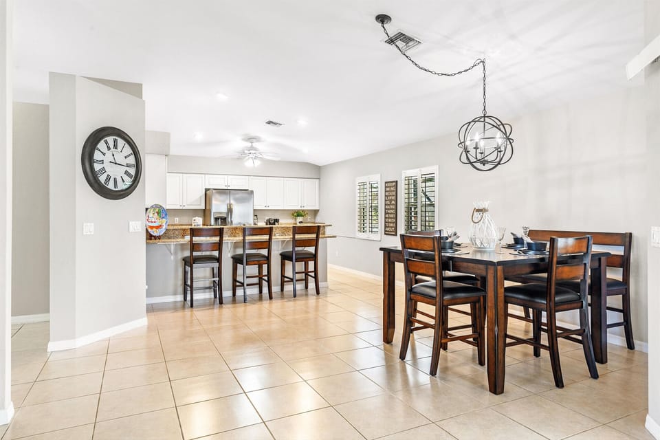 The dining area has room for 5 & the breakfast bar has an additional 3 seats