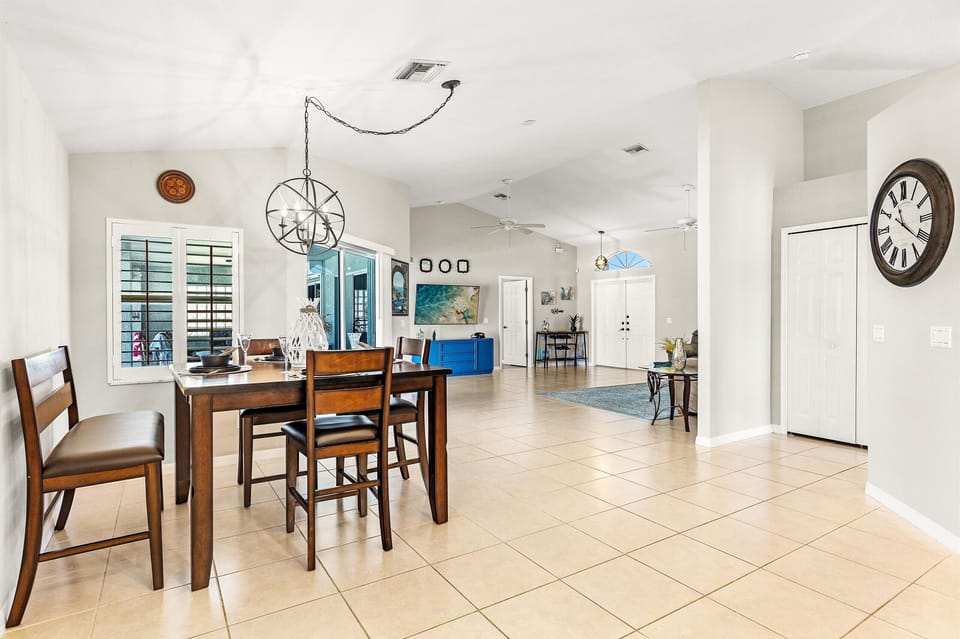 The dining area sits between the living room & kitchen