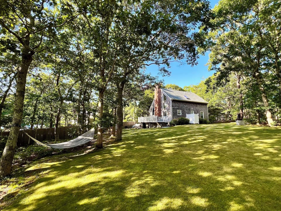 Backyard with hammock, fire pit, new outdoor shower, and hot tub 