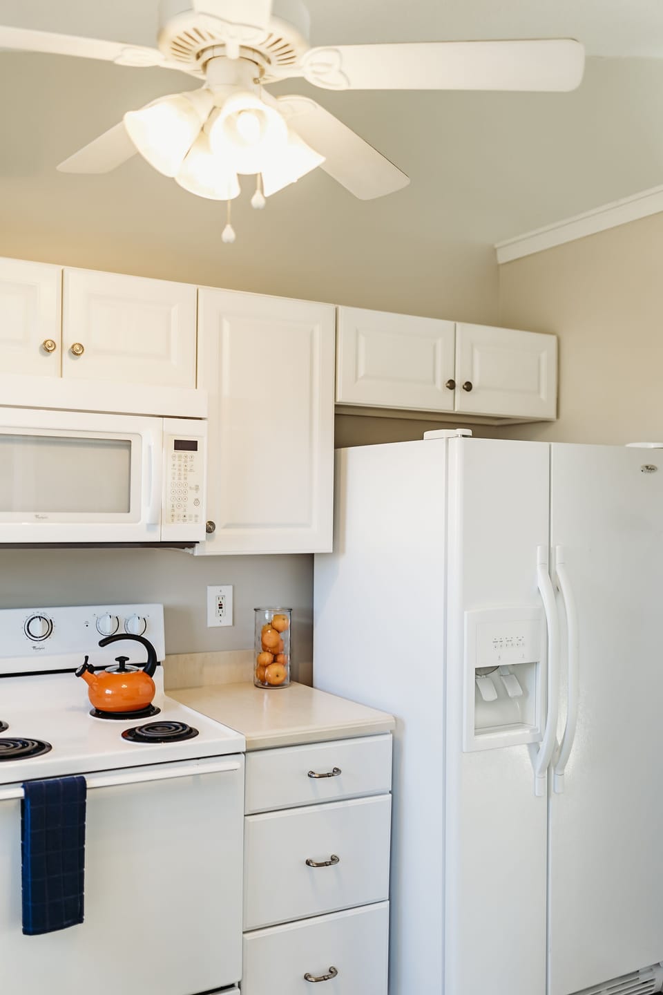 It is a full kitchen with side-by-side refrigerator.