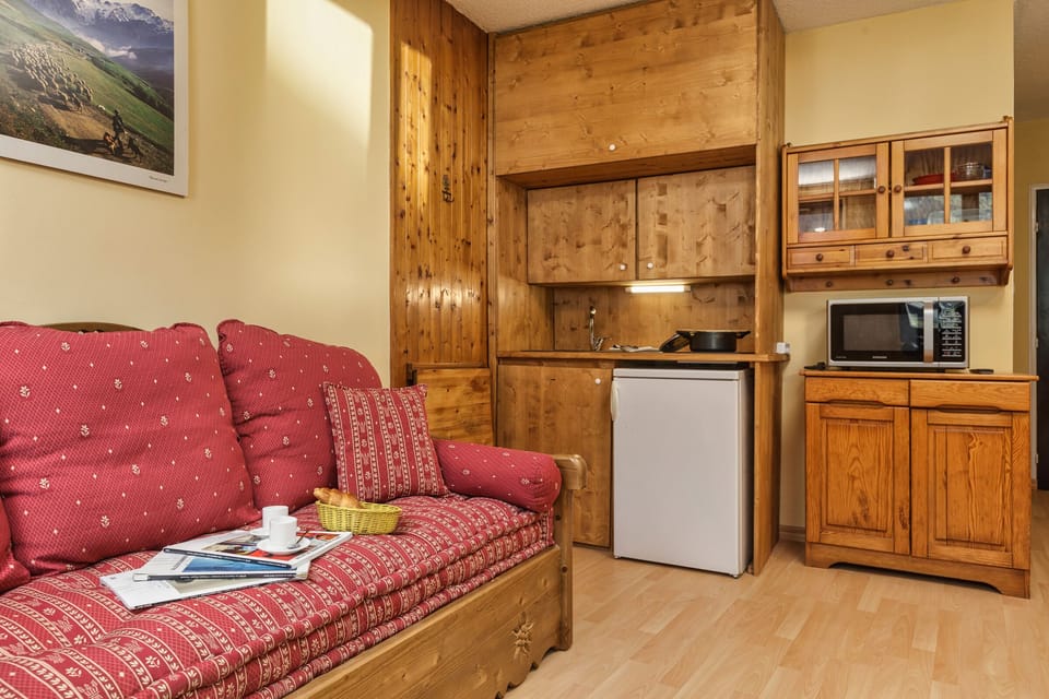 Practical kitchen and big sofa bed