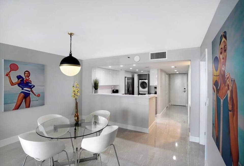 Dining area with views of front entry and fully equipped kitchen