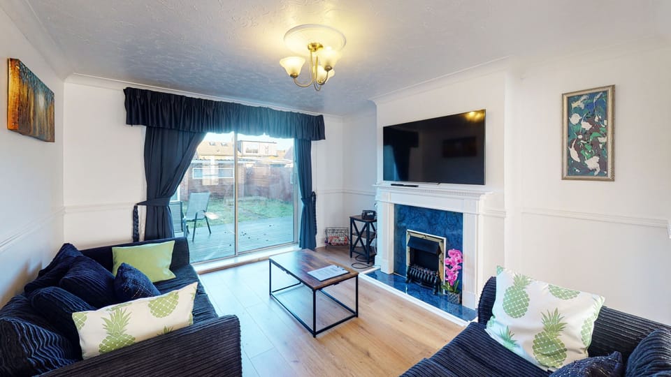 Living Room with large wall mounted TV