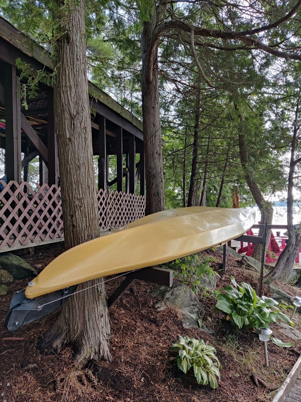 A covered, historic picnic shelter overlooks the water.