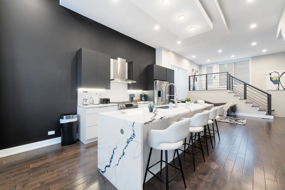 A beautifully designed chic kitchen with sleek finishes and a polished, modern look.