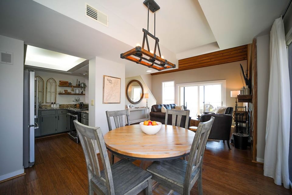Dining area seats 6 with folding chairs in entry closet. 