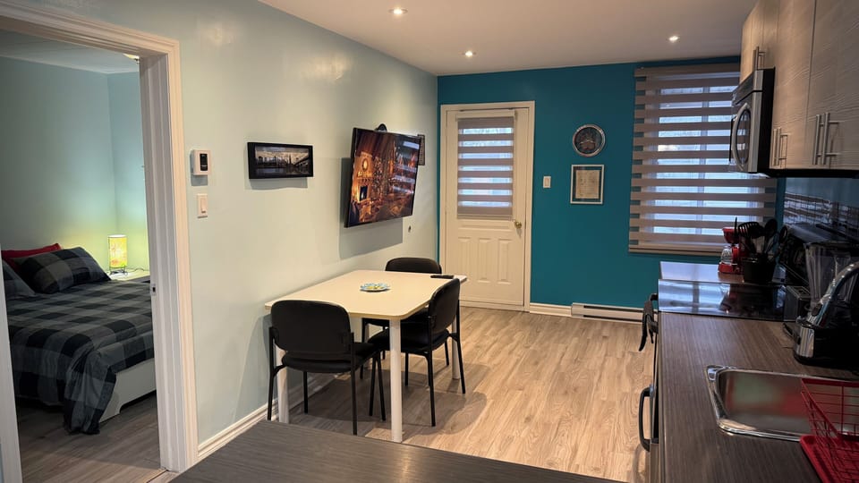 Dining area and entrance to bedroom