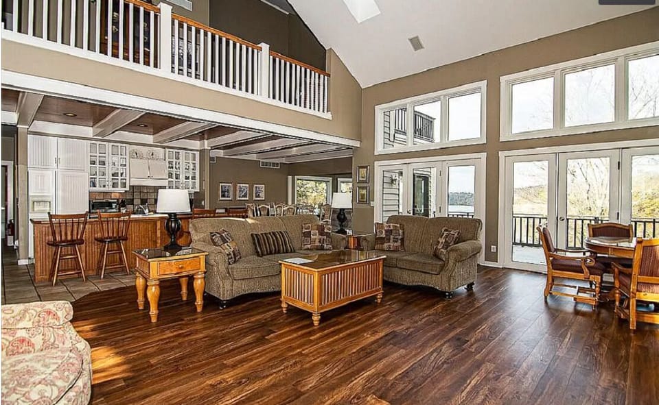 Family room, view of kitchen, dining, sunroom, and loft