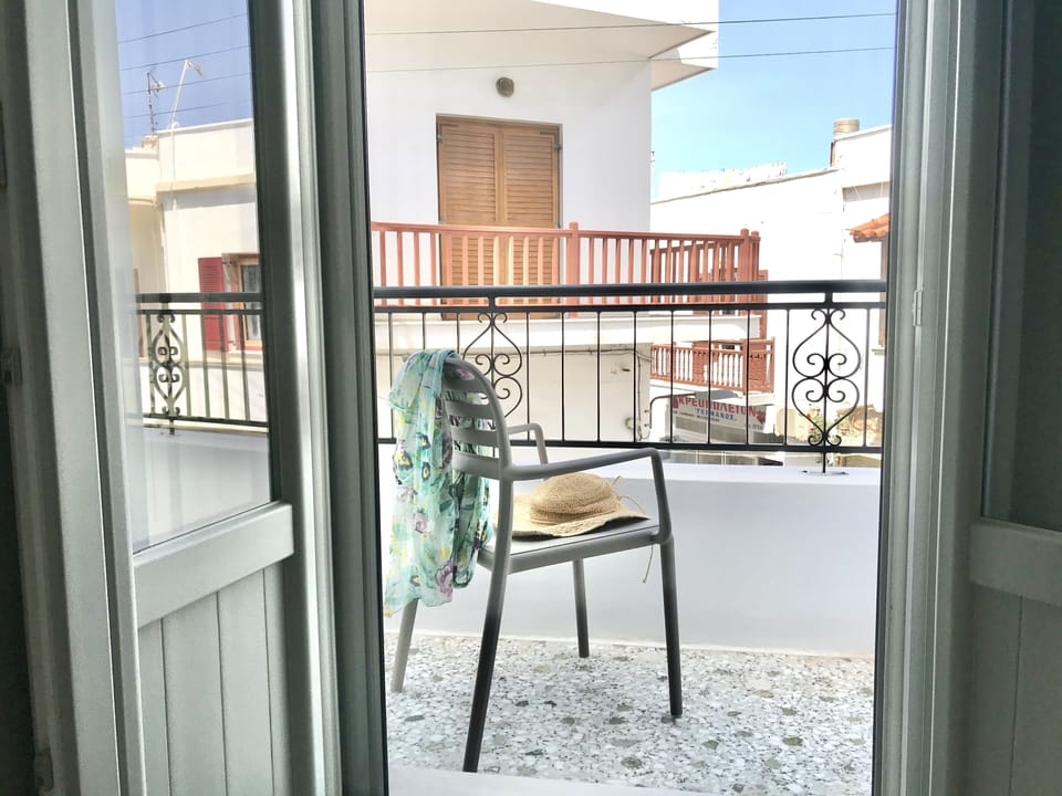 Living room balcony overlooking the street to people watch.