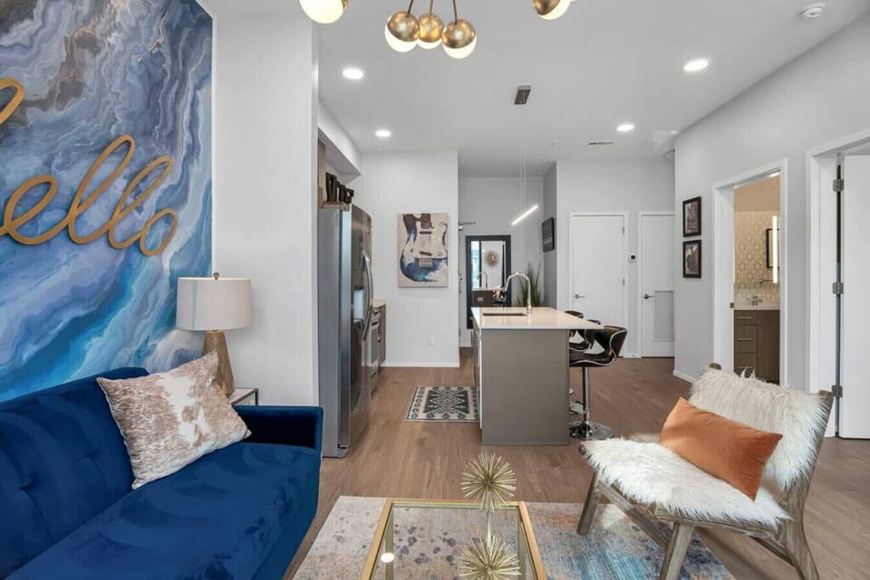 Spacious living room with pullout couch and patio facing outdoor pool! Smart TV with all the apps you could want. Air Mattress also available.