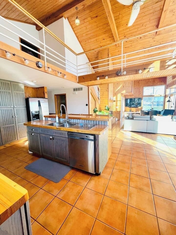 Open concept living area with vaulted ceilings and plenty of space to gather.