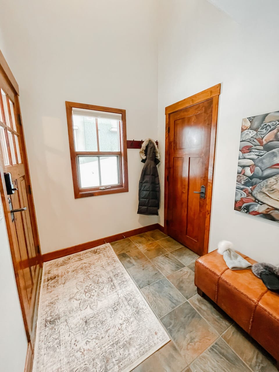 Front entrance that leads directly to ski way. Hall closet with shelving.  