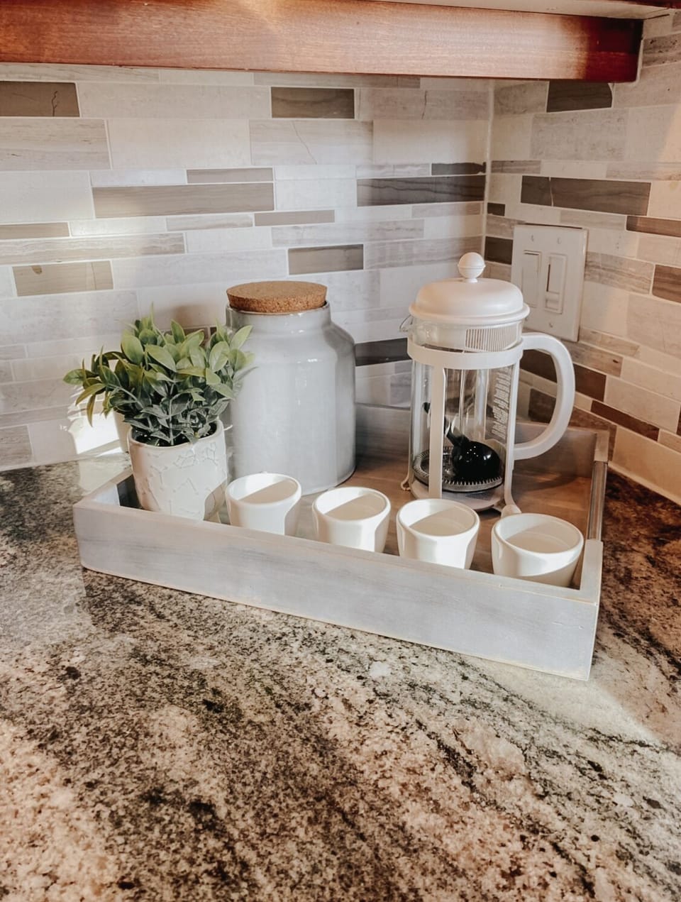 Nespresso machine, bodum press, drip coffee maker and coffee grinder. 