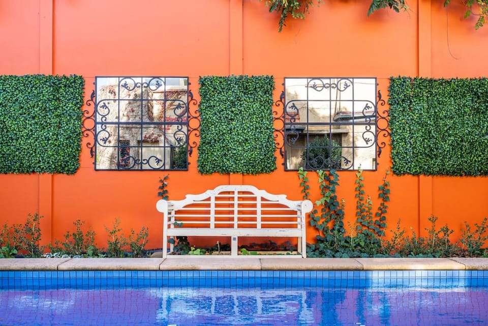Heated pool with pool fence