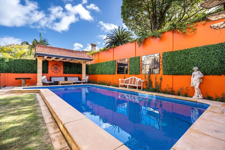 Heated pool with pool fence