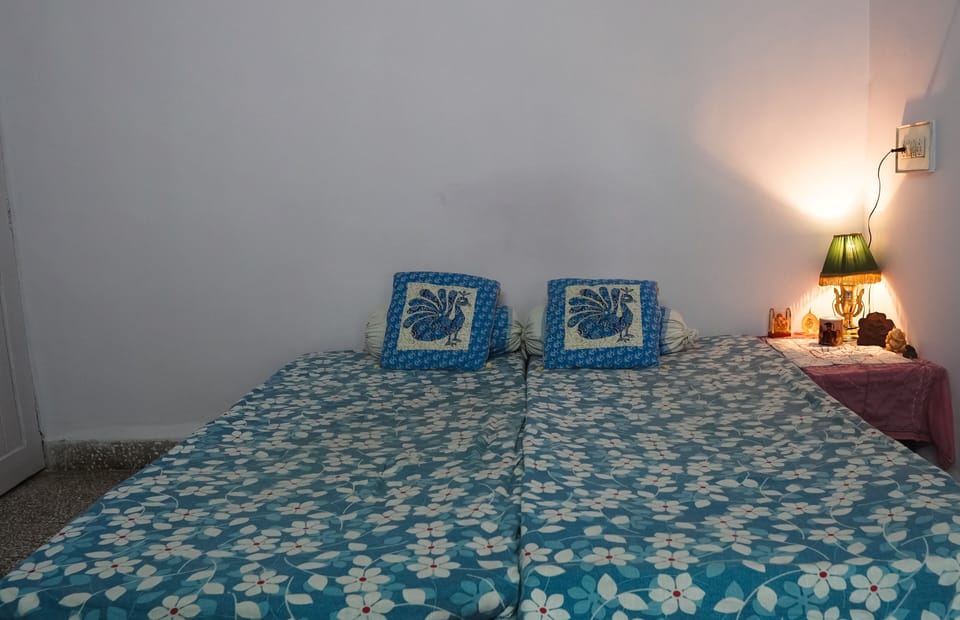 Two single beds turned to a double bed for guests