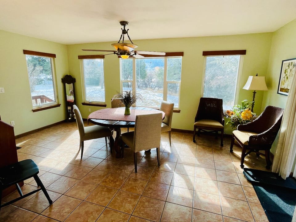 Spacious & bright dining room w/ 2 walk-outs to North and South deck