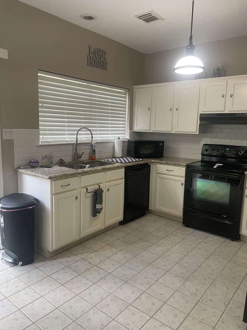 Kitchen with electric appliances, garbage disposal and dishwasher