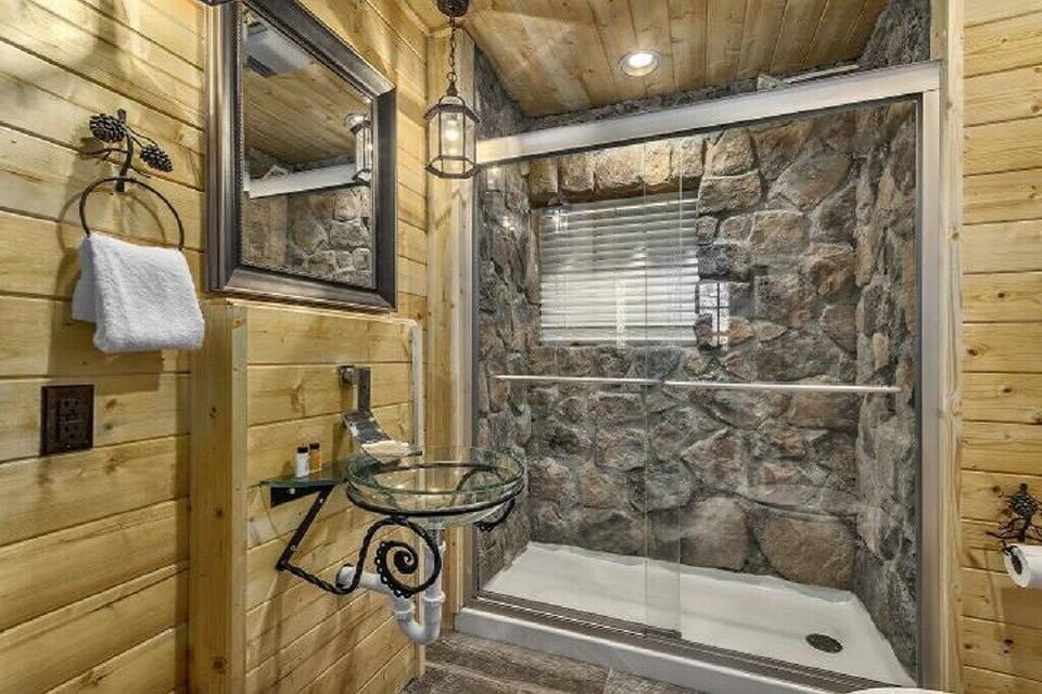 Master stone bathroom located on the main level