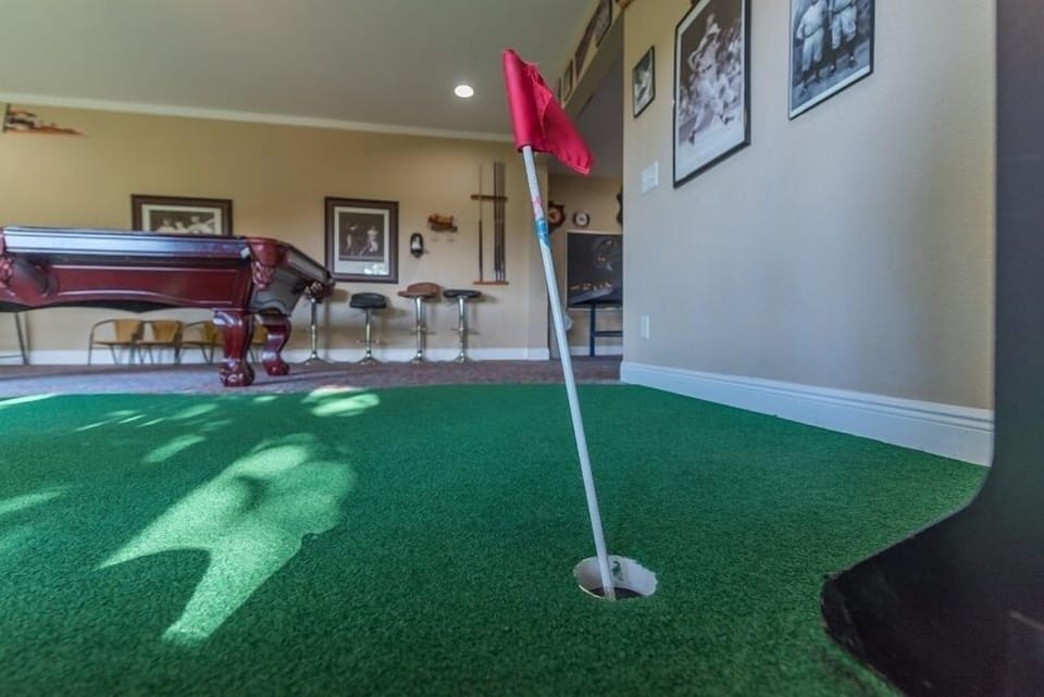 Practice on the indoor putting green