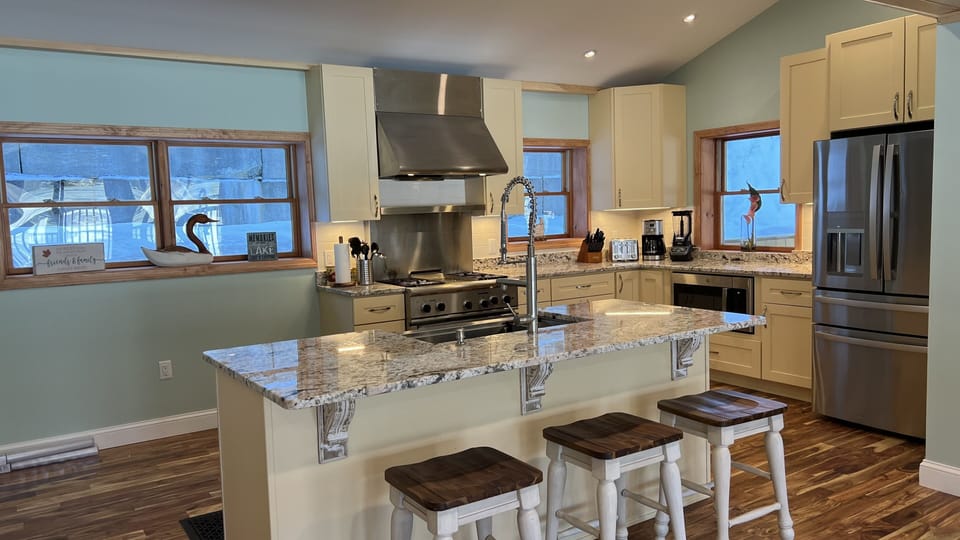 Modern Kitchen will all stainless steel appliances. 