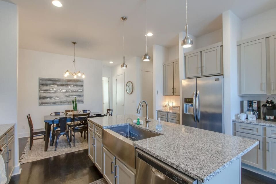 A bright dining area with natural light flows seamlessly into the open kitchen.