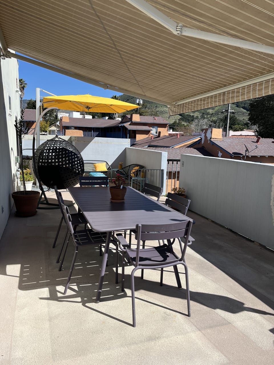 Large dining table can seat 6-8, propane gas grill and bar cart complement