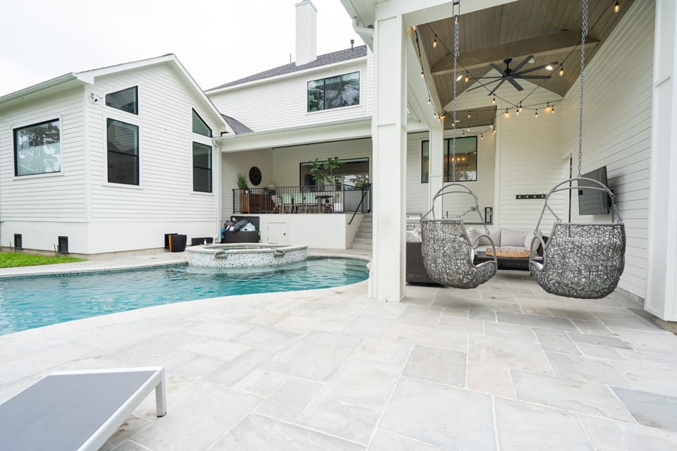 Fun hanging chairs, built-in natural gas grill & outdoor kitchen. Relaxing!