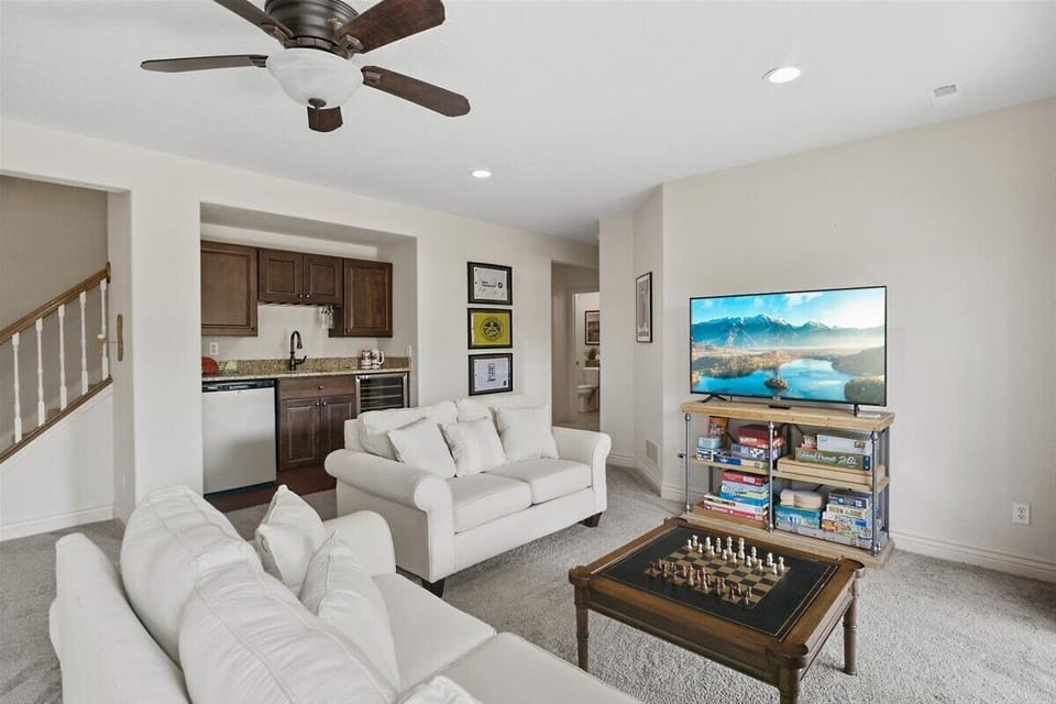 lower level family room and game room with wet bar, mini fridge and wine cooler