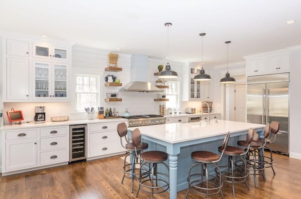 Kitchen Has Center Island with Breakfast Bar and Has Stainless Steel Appliances