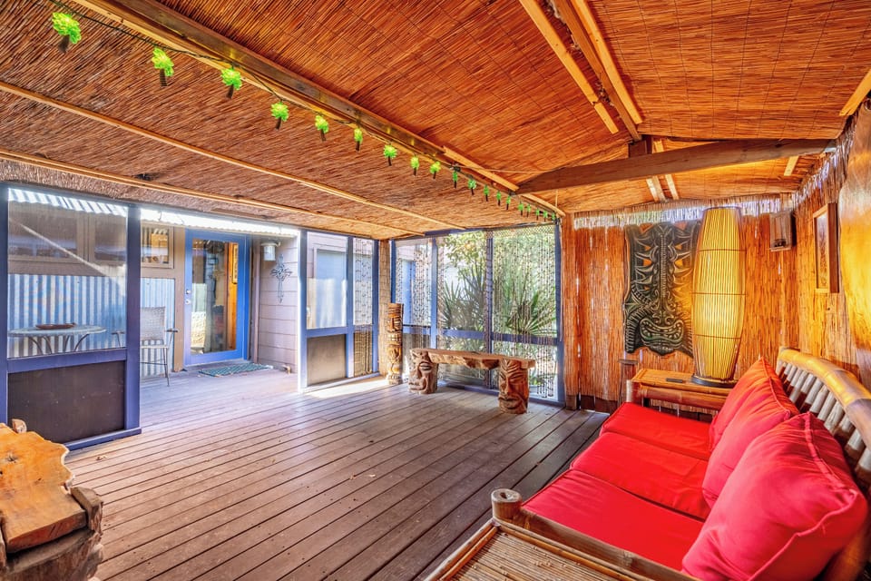 Secluded, outdoor tiki room across from kitchen, dining room with a door to BR