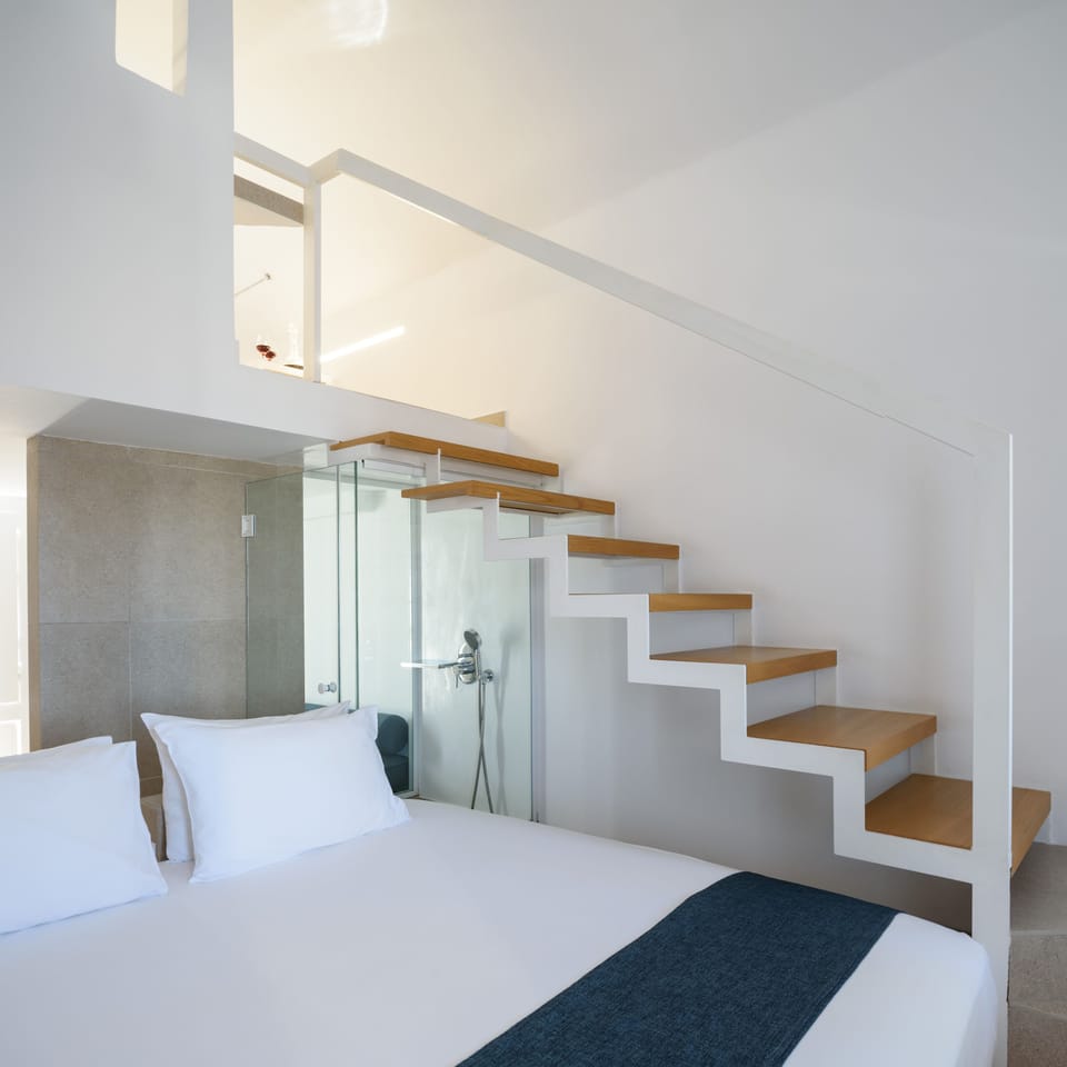 Bedroom and staircase to the bathroom