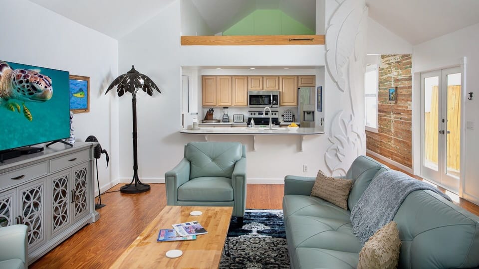 The kitchen has a window opening to the living area...