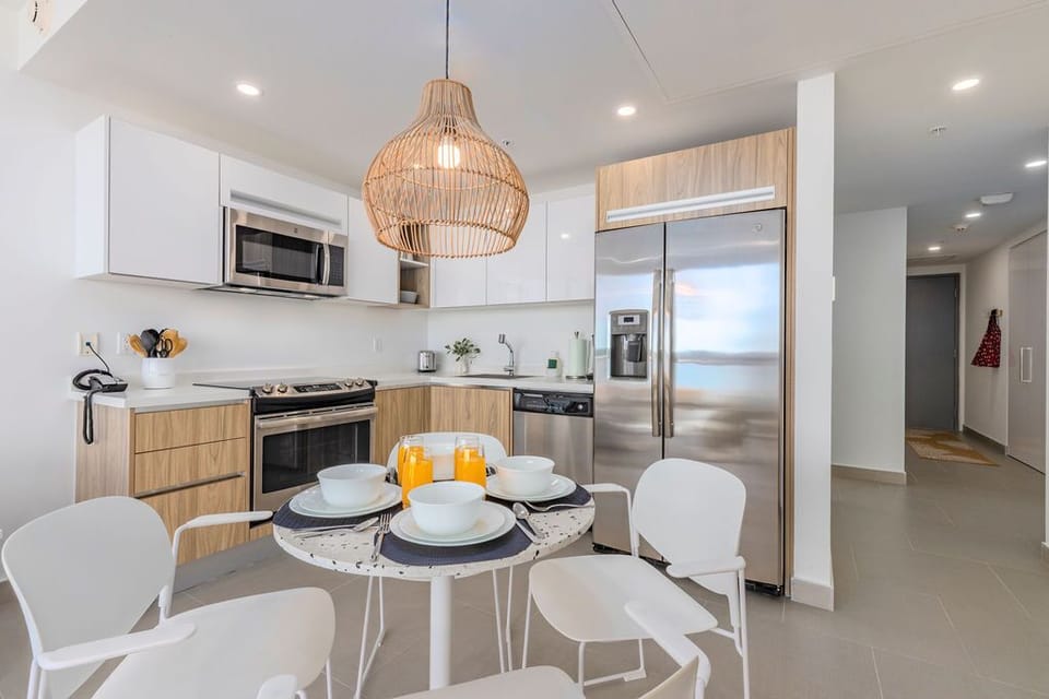 Bright, modern kitchen awaits with stainless steel appliances, ample counter space, and a cozy breakfast nook perfect for morning coffee and planning your day's adventures.