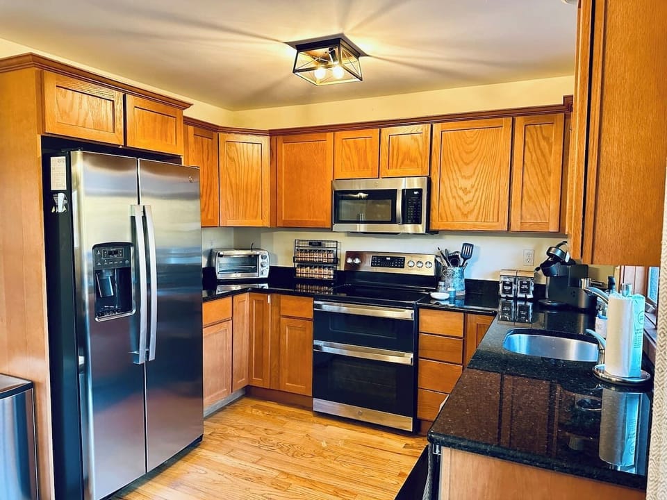 House 1 •  Main Floor •  Fully Equipped Kitchen • NEW Stainless Appliances • Granite Countertops • Seating for 8 • Coffee Bar
