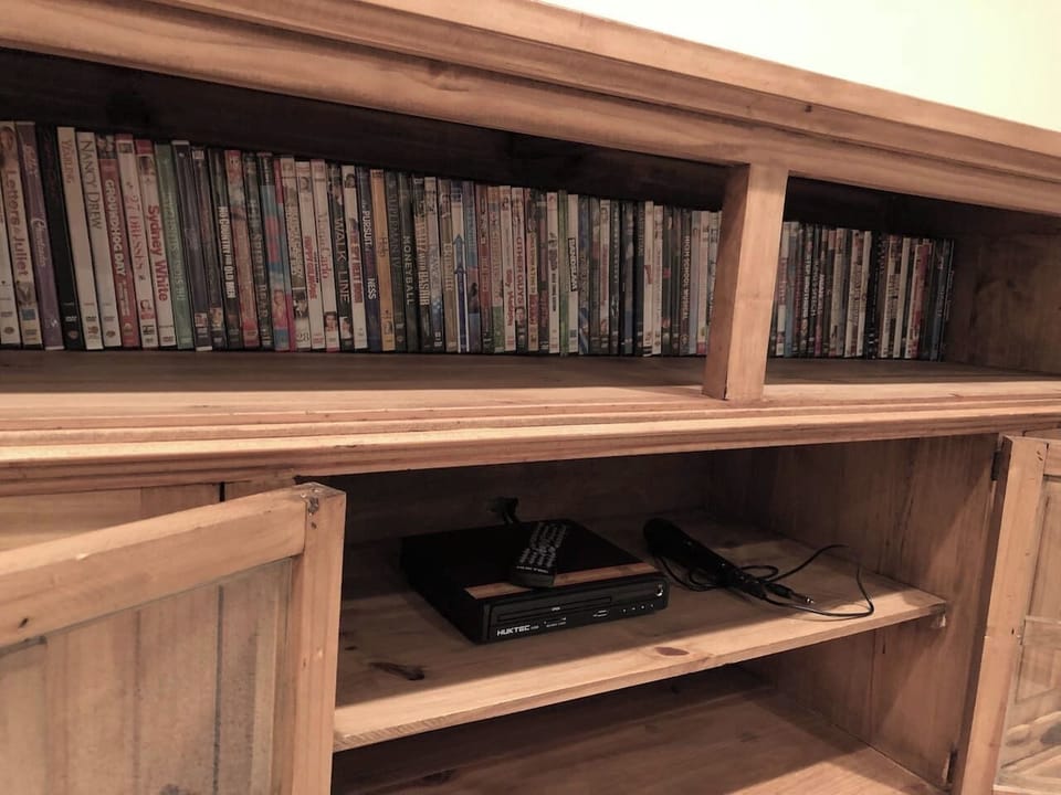 House 1 • Downstairs • Game Room • 65" Roku TV • Hulu Live TV • Large DVD Selection • Ping Pong Table • Knock Hockey • Wet Bar
